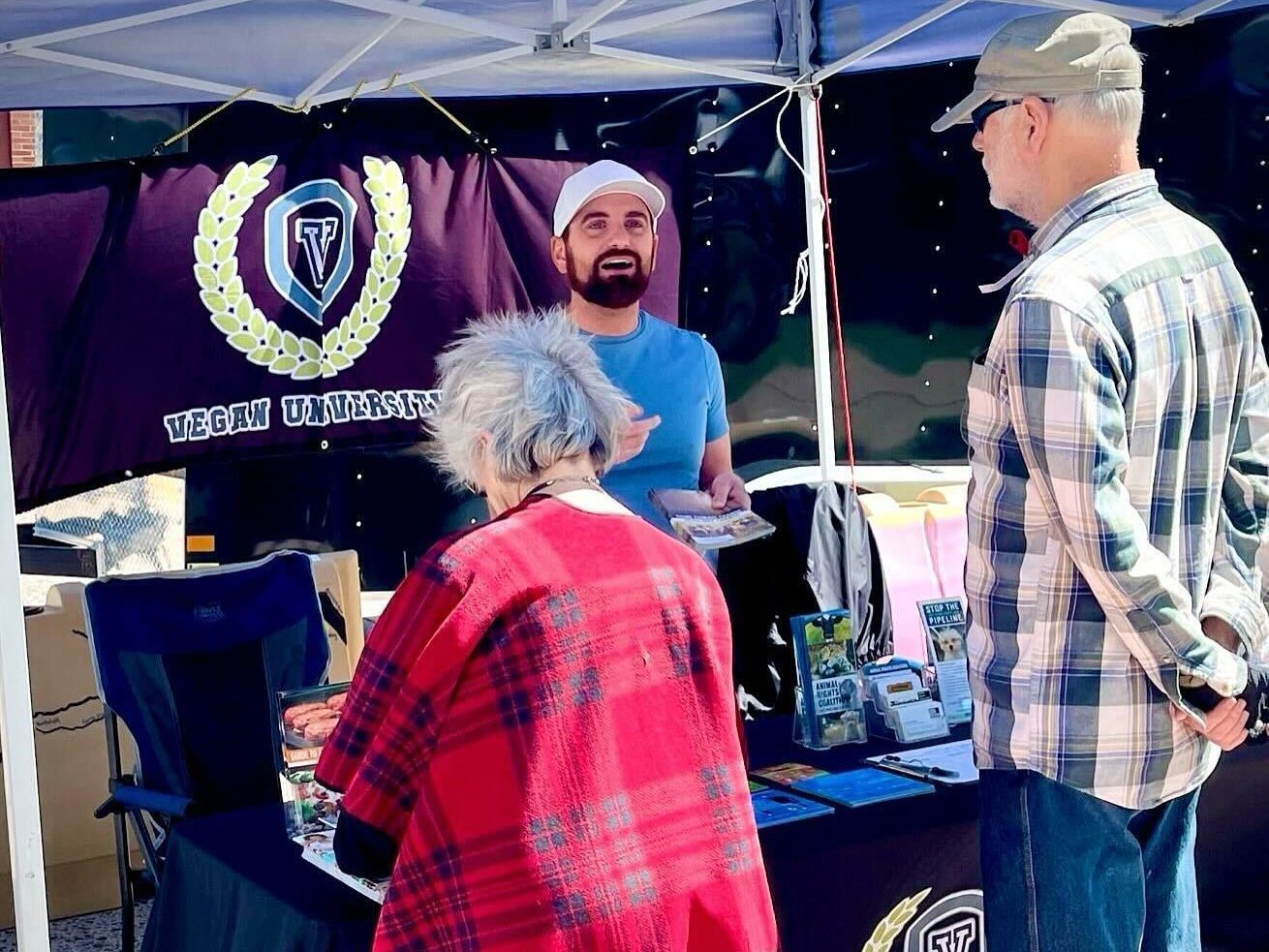 Two people visiting presentation booth
